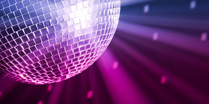 Sparkling disco ball at event.