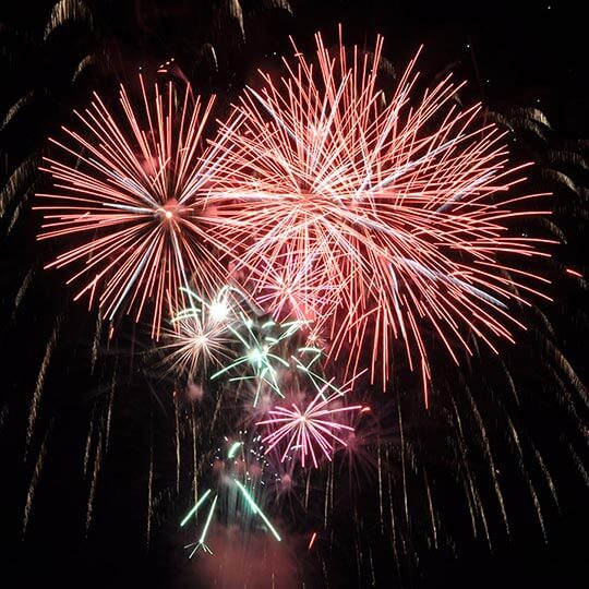 Multiple coloured rockets in fitzpatricks fireworks display.